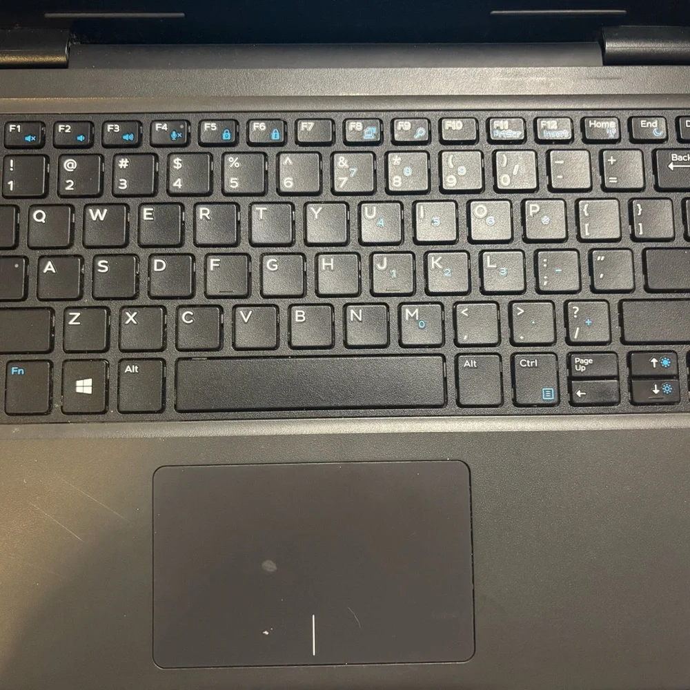 Dell Black Professional Laptop with QWERTY Keyboard and Sleek Design